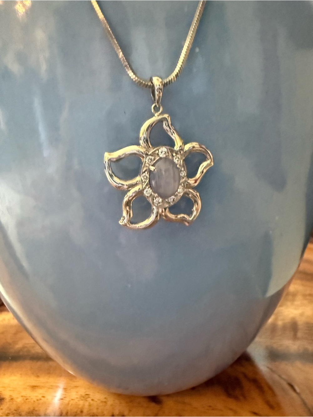White gold Floral Pendant Necklace with Pale Blue Star Sapphire in Center Stone